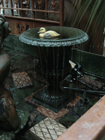 Small bronze ribbed garden urn