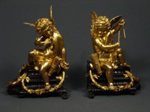 A pair of French Louis XV style gilt and patinated bronze Chenets Cira 1880