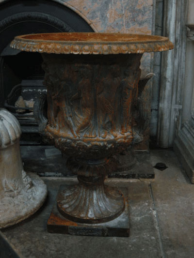 Original cast iron bacchanalia urn